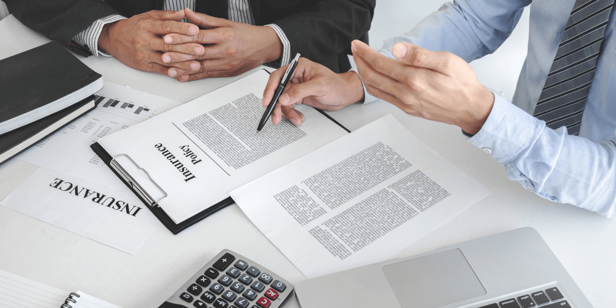 Two people going over commercial insurance contract